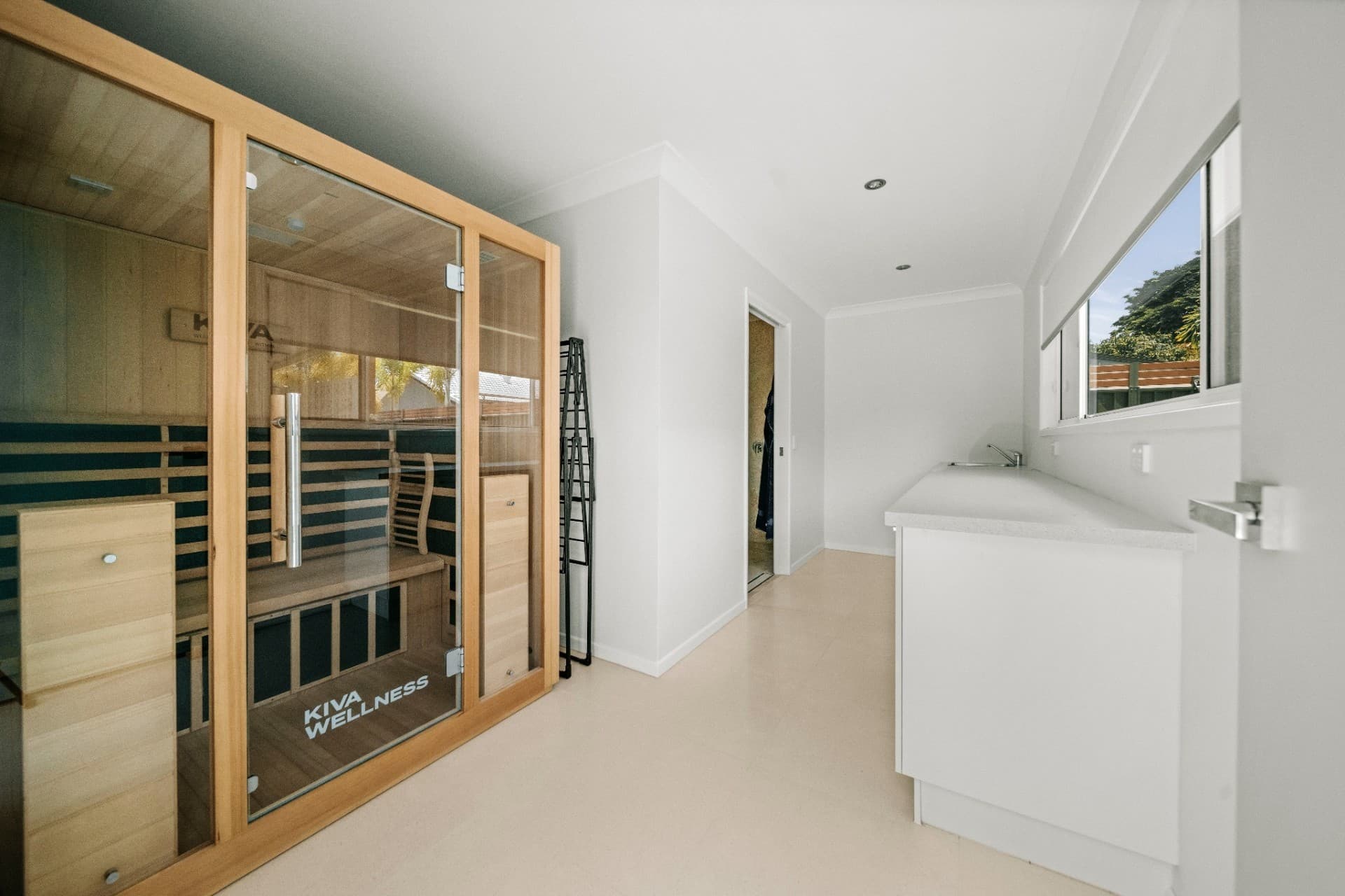 Mermaid Waters wellness room with Kiva Wellness infrared sauna and adjoining hallway.